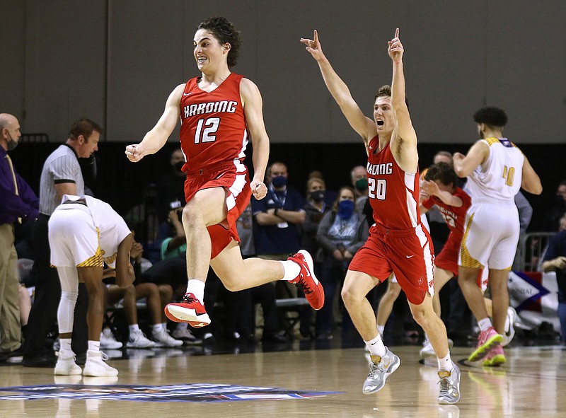 Kyle Ferrie (12) and Ty Dugger of Harding Academy rejoice after the final buzzer in the Wildcats’ victory over Mayflower in the Class 3A boys state championship game Friday at Bank OZK Arena in Hot Springs. More photos available at arkansasonline.com/320boys3a.
(Arkansas Democrat-Gazette/Thomas Metthe)