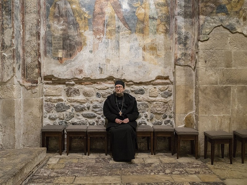 Father Sava Janjic poses at the 14th-century Visoki Decani Monastery in western Kosovo, one of the holiest sites of the Serb Orthodox Church.
(The New York Times/Laura Boushnak)