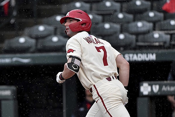 Arkansas batter Cayden Wallace (7) watches the ball after hitting a home run against Southeast Missouri State during an NCAA baseball game on Sunday, Feb. 28, 2021, in Fayetteville. (AP Photo/Michael Woods) Arkansas batter Cayden Wallace (7) watches the ball after hitting a home run against Southeast Missouri State during an NCAA baseball game on Sunday, Feb. 28, 2021, in Fayetteville. (AP Photo/Michael Woods)