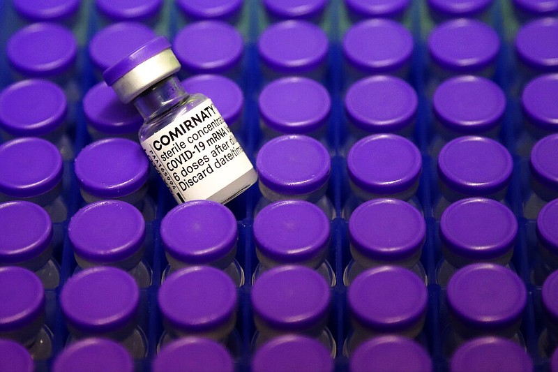 Vials of the Pfizer/BioNTech covid-19 vaccine lie in a box during preparations at the Vaccine Village in Ebersberg near Munich, Germany, in this March 19, 2021, file photo. (AP/Matthias Schrader)