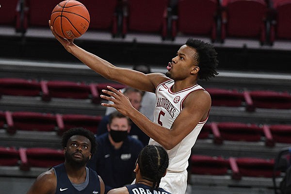 Arkansas guard Moses Moody (5) goes up for a shot during a game against Oral Roberts on Sunday, Dec. 20, 2020, in Fayetteville. Arkansas guard Moses Moody (5) goes up for a shot during a game against Oral Roberts on Sunday, Dec. 20, 2020, in Fayetteville.
