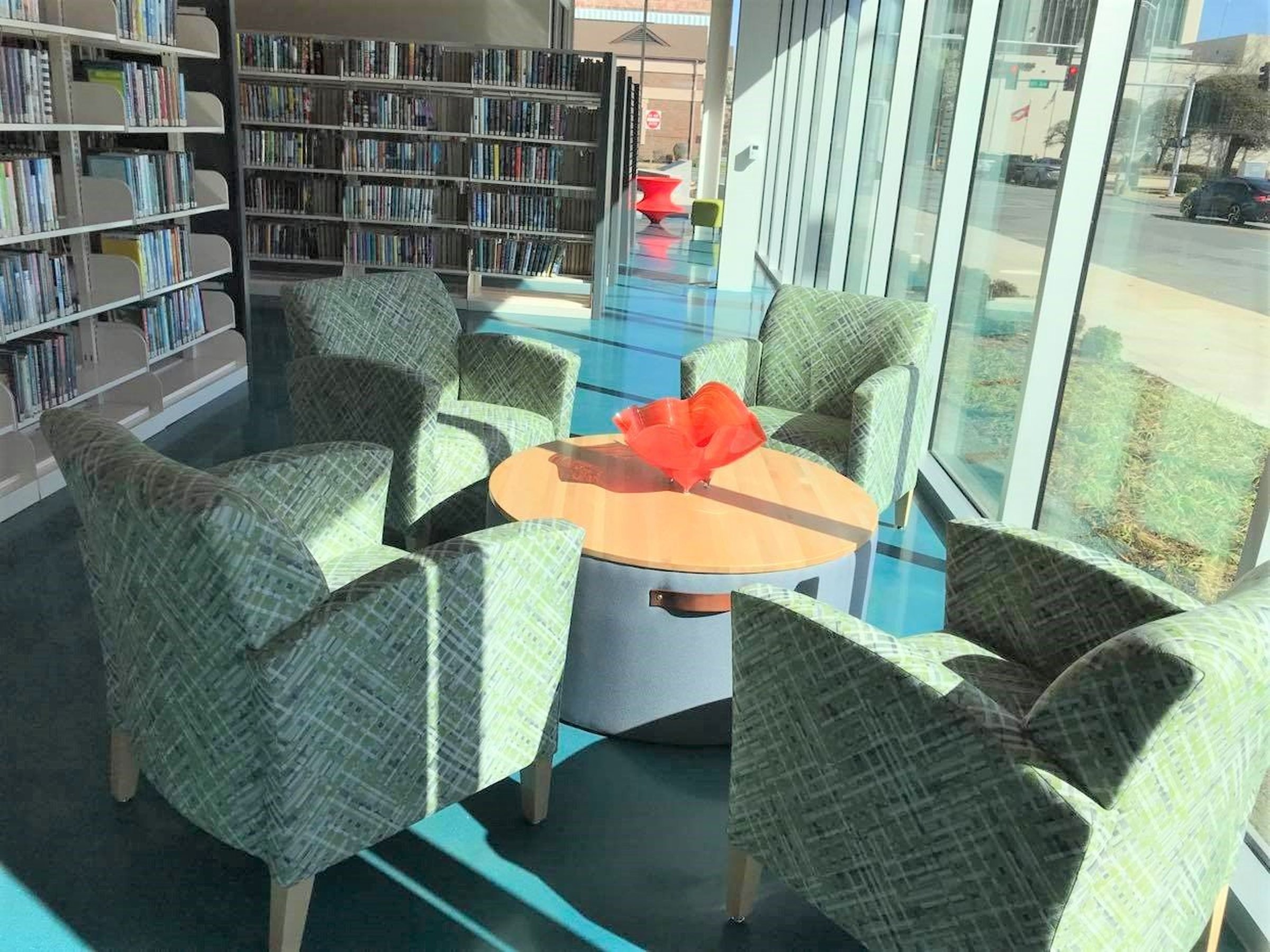 Glass artist donates bowl as library decor