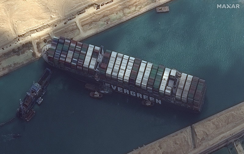 This satellite image from Maxar Technologies shows the cargo ship MV Ever Given on Friday as it remains stuck in the Suez Canal near Suez, Egypt, where other vessels are stacking up behind it. 
(AP/Maxar Technologies)