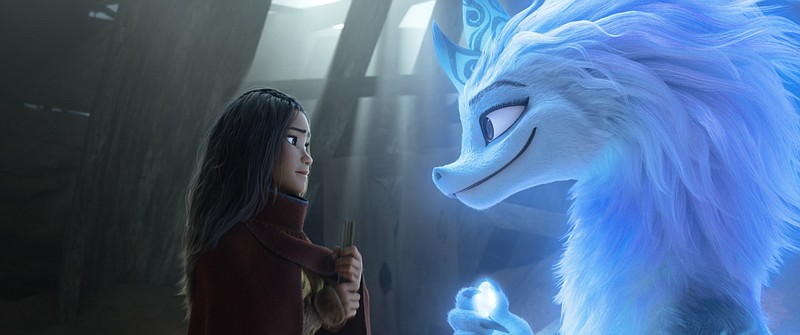 Warrior princess Raya, voiced by Kelly Marie Tran, seeks the help of Kumandra’s last surviving dragon Sisu, voiced by Awkwafina, in the new Disney film “Raya and the Last Dragon,” which was co-written by El Dorado-native Qui Nguyen. (Courtesy of Disney)