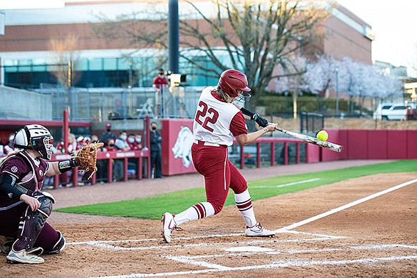 Arkansas' Linnie Malkin (22) hits a home run during a game against Mississippi State on Friday, March 26, 2021, in Fayetteville. (Photo by David Beach/Special to the Democrat-Gazette) Arkansas' Linnie Malkin (22) hits a home run during a game against Mississippi State on Friday, March 26, 2021, in Fayetteville. (Photo by David Beach/Special to the Democrat-Gazette)