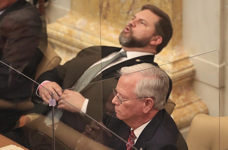 Rep. Jim Dotson (top), R-Bentonville, reacts as he and Rep. Ken Bragg, R-Sheridan, watch the vote tally, Wednesday March 17, 2021 at the State Capitol for Bragg's bill, House Bill 1371, that would fund private school vouchers for students in need with state income tax dollars. The bill failed to pass. More photos at arkansasonline.com/318house/. (Arkansas Democrat-Gazette/Staton Breidenthal)