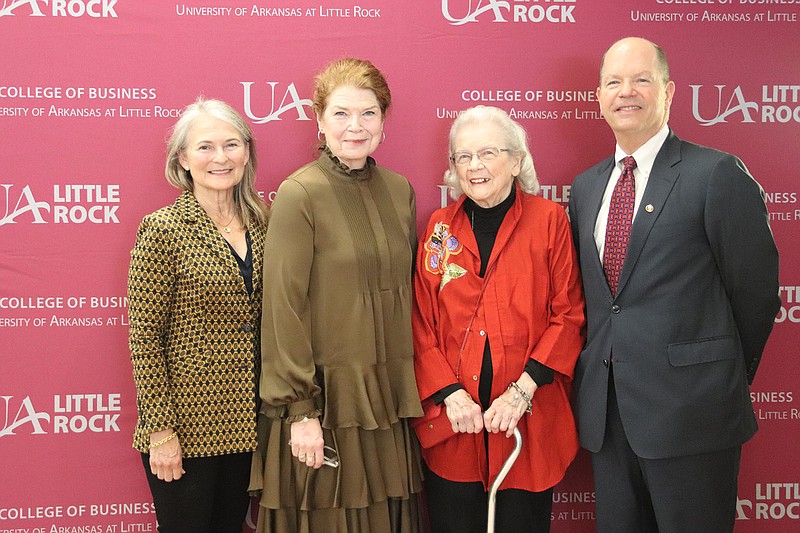 Stephanie Kelley, Kay Kelley Arnold and Tommie Kelley with honoree Hank Kelley at the Distinguished Alumni Luncheon of the University of Arkansas at Little Rock School of Business, held March 12 in the ballroom of the Little Rock Marriott..(Arkansas Democrat-Gazette -- Helaine R. Williams)