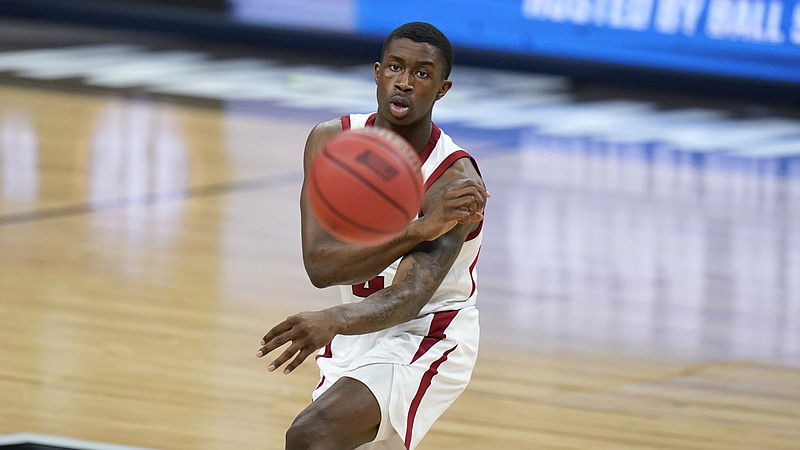 Arkansas' Davonte Davis passes during the first half of a Sweet 16 game against Oral Roberts in the NCAA men's college basketball tournament at Banker's Life Fieldhouse, Saturday, March 27, 2021, in Indianapolis. (AP Photo/Jeff Roberson)