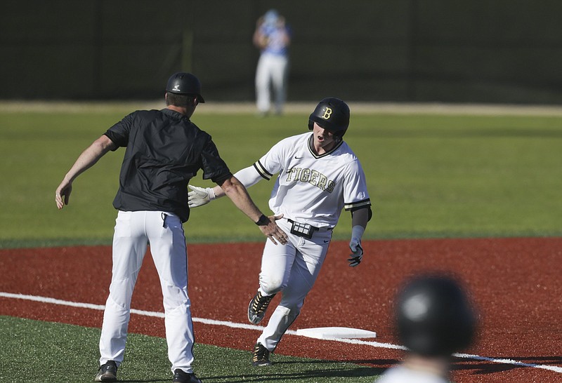 Bentonville Payton Allen (23) runs home for a score, Monday, March 29, 2021 during a baseball game at the Tiger Athletic Complex in Bentonville. Check out nwaonline.com/210330Daily/ for today's photo gallery. .(NWA Democrat-Gazette/Charlie Kaijo)