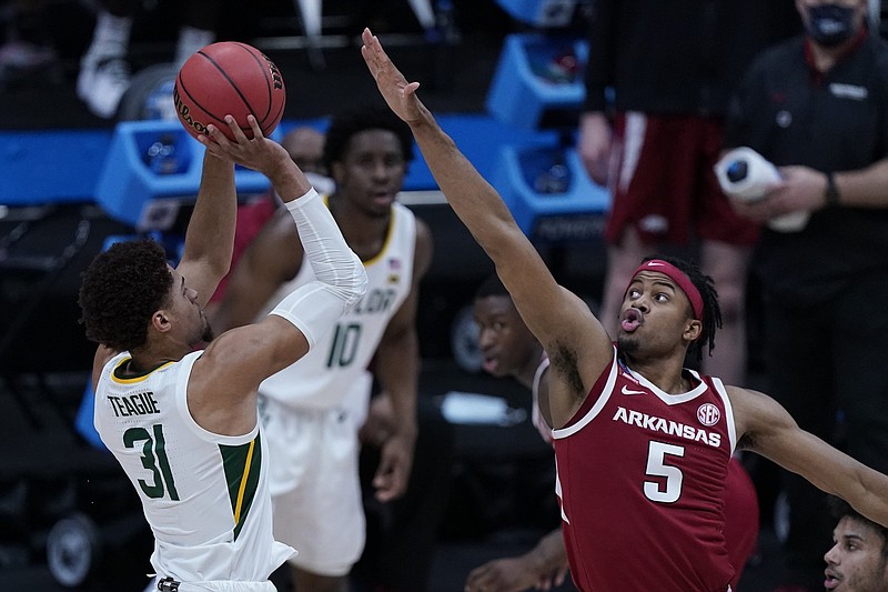 Baylor guard MaCio Teague (31) shoots on Arkansas guard Moses Moody (5) during the first half of an Elite 8 game in the NCAA men's college basketball tournament at Lucas Oil Stadium, Monday, March 29, 2021, in Indianapolis. (AP Photo/Michael Conroy) Baylor guard MaCio Teague (31) shoots on Arkansas guard Moses Moody (5) during the first half of an Elite 8 game in the NCAA men's college basketball tournament at Lucas Oil Stadium, Monday, March 29, 2021, in Indianapolis. (AP Photo/Michael Conroy)