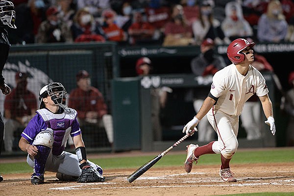 Arkansas second baseman Robert Moore watches Tuesday, March 30, 2021, as the ball hits the scoreboard for a solo home run during the fifth inning of play against Central Arkansas in Baum-Walker Stadium in Fayetteville. Arkansas second baseman Robert Moore watches Tuesday, March 30, 2021, as the ball hits the scoreboard for a solo home run during the fifth inning of play against Central Arkansas in Baum-Walker Stadium in Fayetteville.