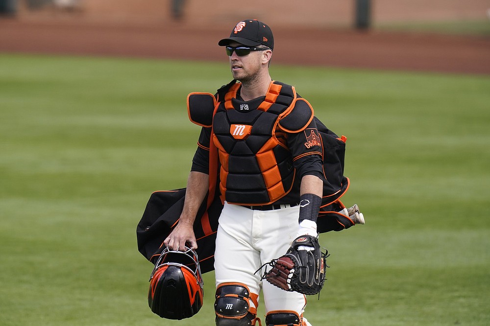 San Francisco Giants catcher Buster Posey returns to the field this season after opting out of playing last year because of coronavirus concerns. “Watching the games on TV last year and seeing just cardboard fans in the stands, it was definitely nice to see some live humans out there,” Posey said.
(AP/Jae C. Hong)
