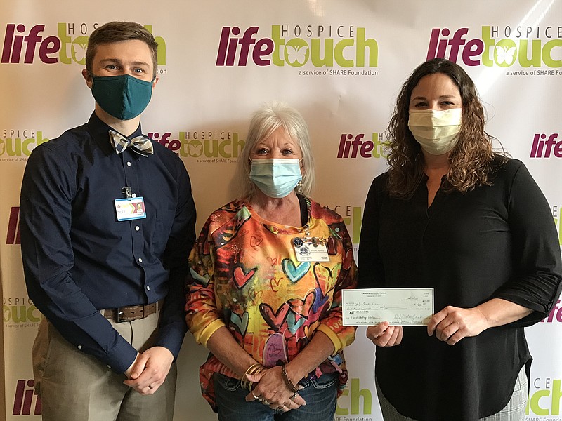 President of the VFW Post 4554 Auxiliary, Deb Carter-Cash, presented Jenifer McLelland, executive director of Life Touch Hospice, and Tyler Turner, outreach coordinator, with a $200 check to start the Patient Pantry. (Contributed)