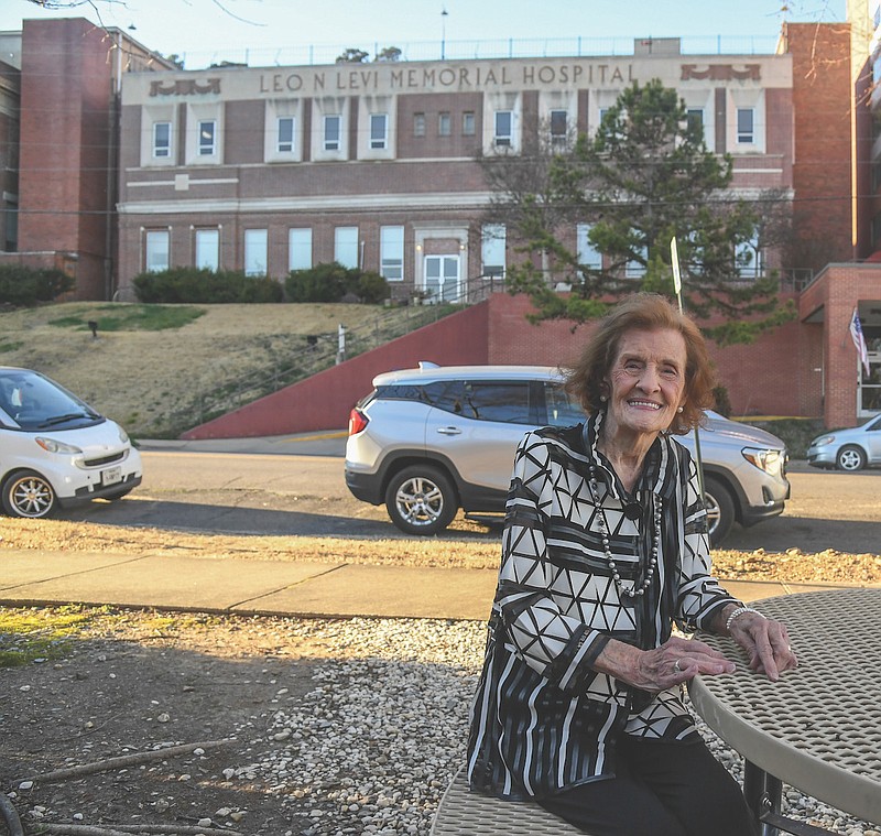 Mary Talley has her photo taken in front of the Levi Hospital on March 3, 2021.-Photo by Grace Brown of The Sentinel-Record