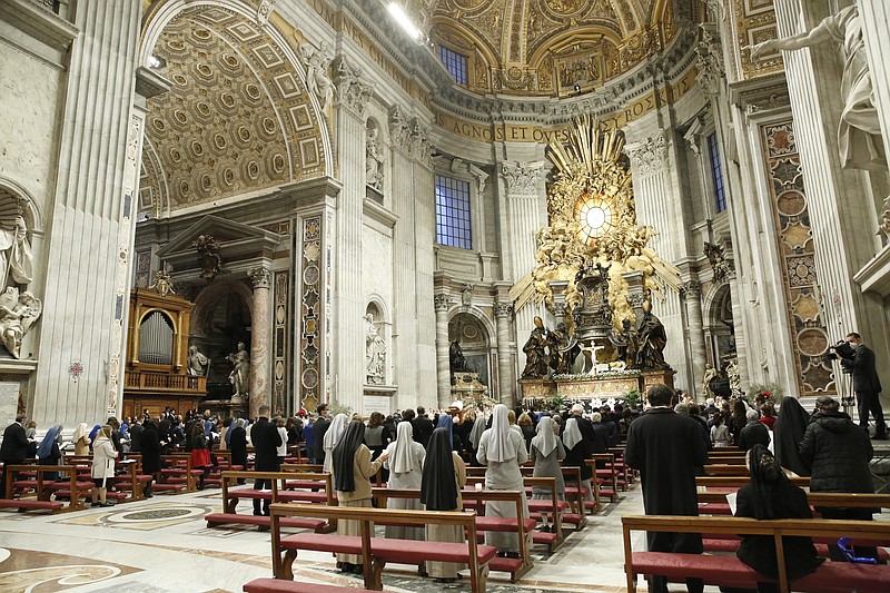 Pope Francis celebrates the Easter Vigil in a nearly empty St. Peter's Basilica as coronavirus pandemic restrictions stay in place for a second year running, at the Vatican, Saturday, April 3, 2021. (Remo Casilli/Pool photo via AP)