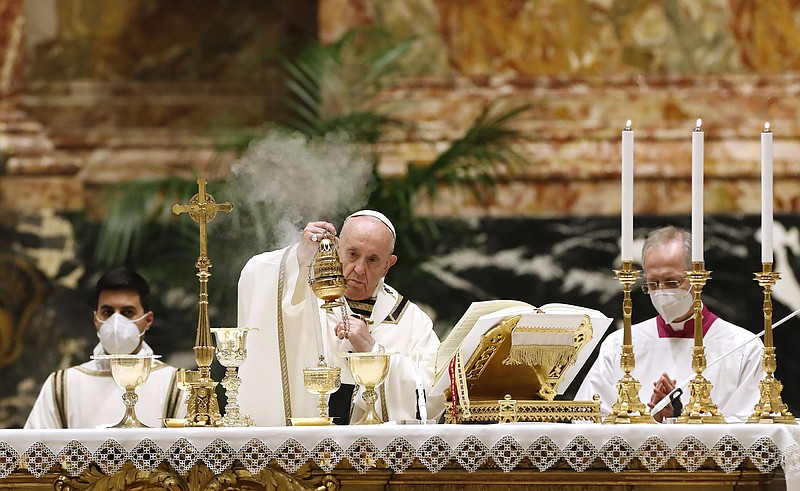 Pope Francis celebrates the Easter Vigil in a nearly empty St. Peter’s Basilica on Saturday as coronavirus pandemic restrictions stay in place for a second year.
(AP/Remo Casilli)