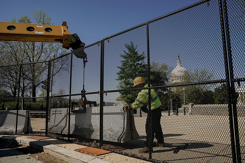 Cement barriers are installed in front of security fencing around the U.S. Capitol on Saturday as Capitol police struggle to find the best way to protect the building and those who use it.
(The New York Times/Amr Alfiky)