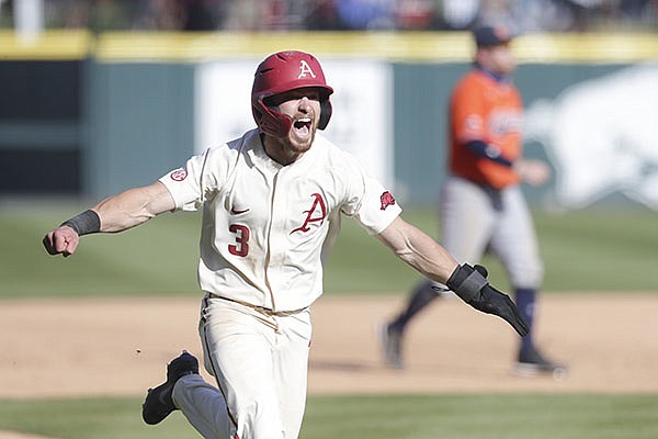 Arkansas left fielder Zack Gregory runs toward home to plate to score the winning run during a game against Auburn on Saturday, April 3, 2021, in Fayetteville. Arkansas left fielder Zack Gregory runs toward home to plate to score the winning run during a game against Auburn on Saturday, April 3, 2021, in Fayetteville.