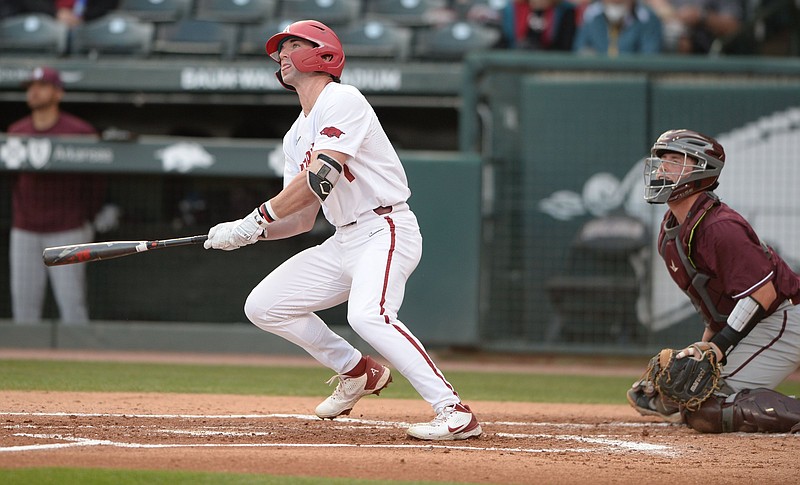 Arkansas right fielder Cayden Wallace watches Tuesday, April 6, 2021, as a solo home run leaves the field during the first inning of play against UALR at Baum-Walker Stadium in Fayetteville. Visit nwaonline.com/210407Daily/ for today's photo gallery. .(NWA Democrat-Gazette/Andy Shupe)