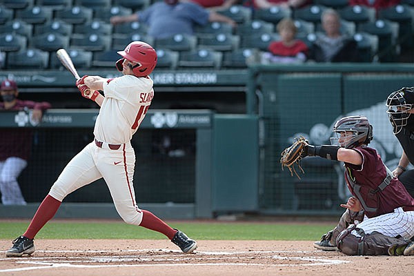 Arkansas first baseman Brady Slavens connects Wednesday, April 7, 2021, for a three-run home run during the first inning of the Razorbacks' 10-3 win over UALR at Baum-Walker Stadium in Fayetteville. Arkansas first baseman Brady Slavens connects Wednesday, April 7, 2021, for a three-run home run during the first inning of the Razorbacks' 10-3 win over UALR at Baum-Walker Stadium in Fayetteville.