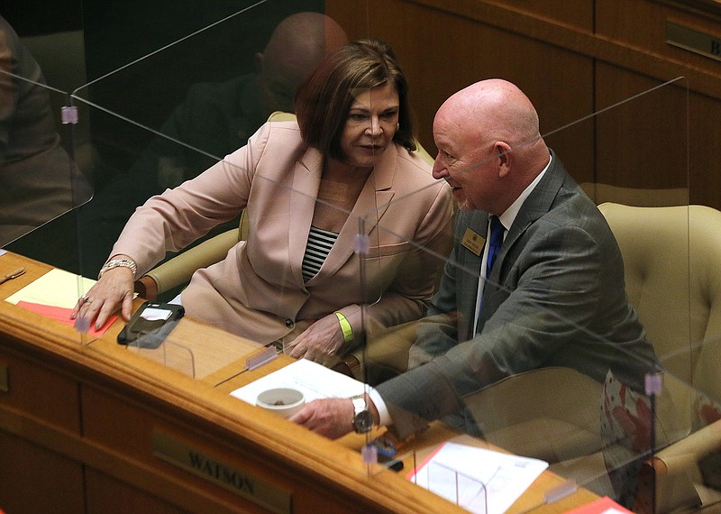 Rep. Charlene Fite, R-Van Buren, talks with Rep. Danny Watson, R-Hope, before the start of Thursday’s House session at the state Capitol.
(Arkansas Democrat-Gazette/Thomas Metthe)