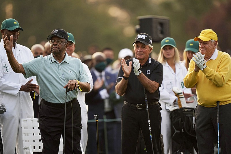 Lee Elder (left), the first Black player at the Masters, acknowledges the crowd Thursday before hitting a ceremonial tee shot with Gary Player (middle) and Jack Nicklaus at Augusta National.
(AP/Matt Slocum)