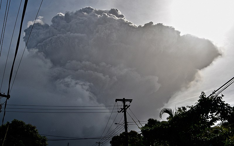 La Soufriere sends a towering ash column into the sky Friday on the eastern Caribbean island of St. Vincent. As surrounding communities were evacuated amid heavy ash fall, experts warned more eruptions were possible.
(AP/Orvil Samuel)