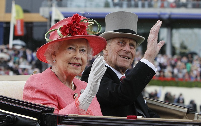 Queen Elizabeth II and Prince Philip are shown in June 2011 in Ascot, England. Elizabeth was known to refer to Philip as “her rock.” More photos at arkansasonline.com/410prince/.
(AP/Alastair Grant)