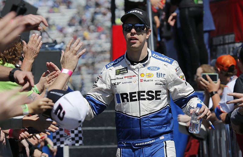 In this March 24, 2019 file photo, NASCAR Cup Series driver Brad Keselowski greets fans during driver introductions prior to the NASCAR Cup Series auto race at the Martinsville Speedway in Martinsville, Va.  
(AP Photo/Steve Helber, File)