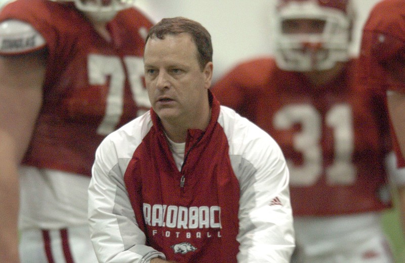 Tim Horton, who served as running backs coach at Arkansas from 2007-12, watches the team run drills during a 2009 practice. Horton was known for excelling as a recruiter and forging lasting relationships with players.
(Arkansas Democrat-Gazette file photo)