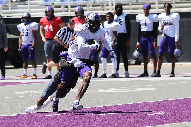 Wideout Lujuan Winningham hauls in a reception on a day when Central Arkansas fought the wind in the passing game during a scrimmage at Estes Stadium in Conway.
(Photo courtesy Central Arkansas Athletics)