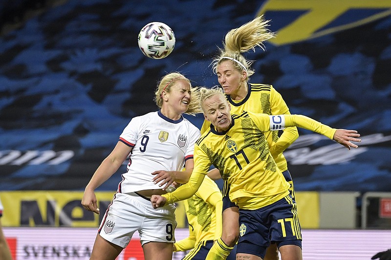 Lindsey Horan (9) of the United States and Sweden’s Carolina Seger (17) and Linda Sembrant leap to make a header during their international friendly soccer match Saturday in Stockholm, Sweden. The teams played to a 1-1 draw.
(AP/Janerik Henriksson)