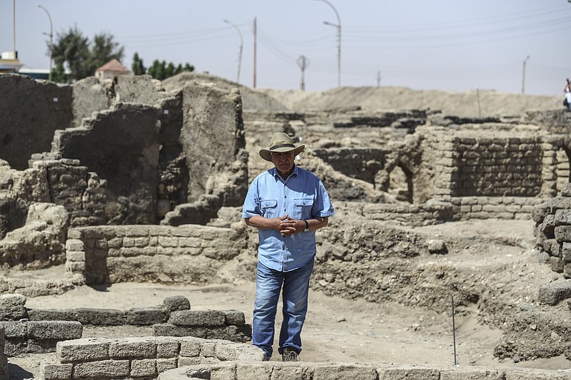 Dr. Zahi Hawass talks to media in a 3,000-year-old lost city in Luxor province, Egypt, Saturday, April 10, 2021. The newly unearthed city is located between the temple of King Rameses III and the colossi of Amenhotep III on the west bank of the Nile in Luxor. The city continued to be used by Amenhotep III's grandson Tutankhamun, and then his successor King Ay. (AP Photo/Mohamed Elshahed)