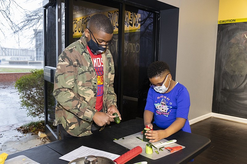 A brother and sister duo prepare nutritious food during the Arts & Science Center for Southeast Arkansas’ 2021 winter CrEATe lab series. CrEATe Lab summer camp will be held July 19-23. 
(Special to The Commercial)
