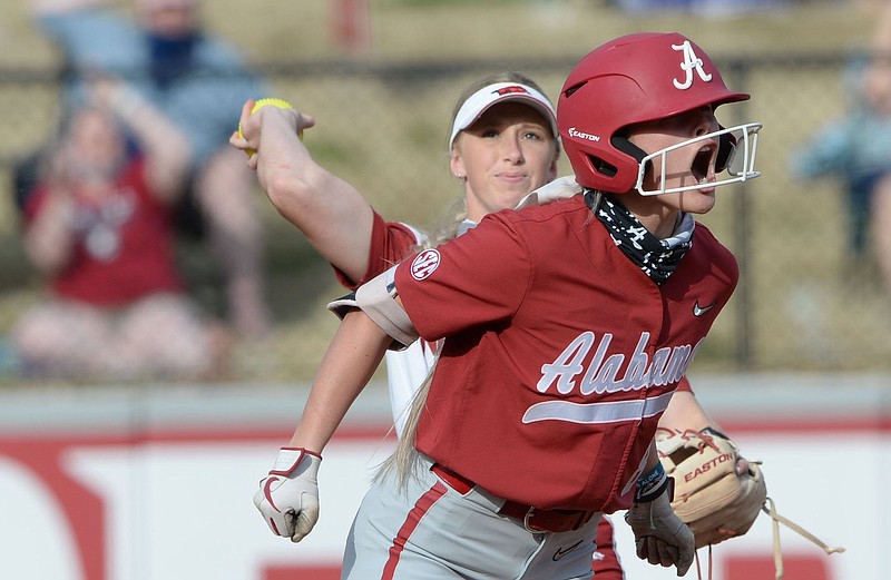 Alabama’s KB Sides celebrates after hitting a two-run double during the No. 3 Crimson Tide’s victory over No. 8 Arkansas on Friday at Bogle Park in Fayetteville. More photos available at arkansasonline.com/410alaua.
(NWA Democrat-Gazette/Andy Shupe)