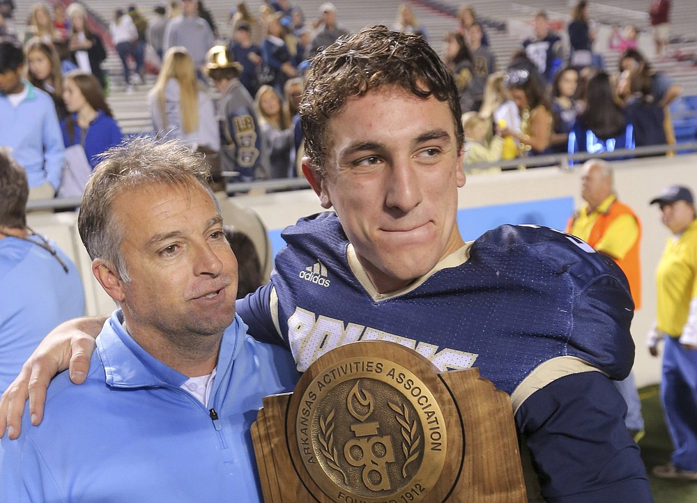 Pulaski Academy Coach Kevin Kelley (left) celebrates with quarterback Layne Hatcher — now at Arkansas State University — after the Bruins won their fourth consecutive Class 5A state championship in 2017 against Little Rock McClellan at War Memorial Stadium in Little Rock. Kelley, who is being inducted into the Arkansas Sports Hall of Fame on Friday, has led the Bruins to nine state titles in his 18 seasons at the Little Rock school.
(Democrat-Gazette file photo)