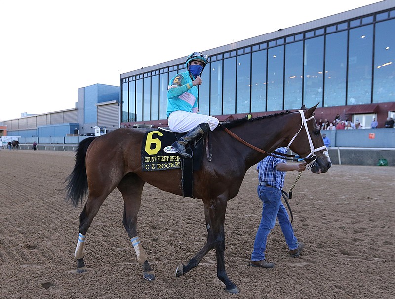 Jockey Florent Geroux pumps his fist after riding C Z Rocket to victory in the $500,00 Count Fleet Sprint Handicap on Saturday at Oaklawn in Hot Springs. More photos at www.arkansasonline.com/411derby/
(Arkansas Democrat-Gazette/Thomas Metthe)