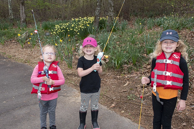 Cousins Chase Campbell, Campbell Grace Appleberry and Reese Campbell on their way to fish in the park’s lake.
(Arkansas Democrat-Gazette/Cary Jenkins)