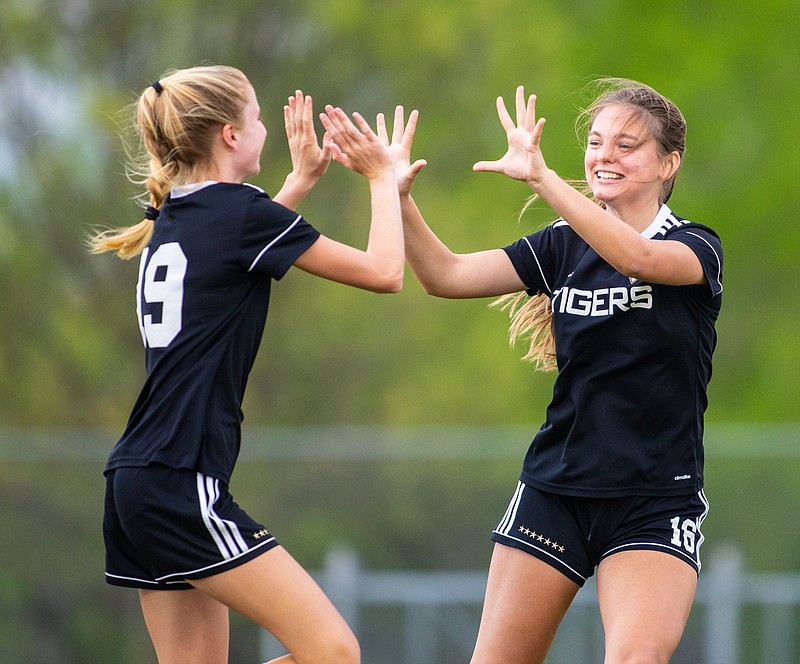 Bentonville’s Star Chesshir (right) celebrates with teammate Allison Fernstrom after scoring a goal during Friday’s victory over Bentonville West. Chesshir added a second goal, and Fernstrom also scored in the Lady Tigers’ 3-0 victory.
(Special to the NWA Democrat-Gazette/David Beach)