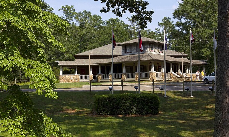 Patrons exit the museum at the Confederate Memorial Park in Mountain Creek, Ala., in this July 19, 2011, file photo. More than 60,000 Confederate veterans returned to Alabama after the Civil War, and residents are still paying a property tax that was levied to support their pensions. Some of the tax is now used to support the park. (AP/Dave Martin)