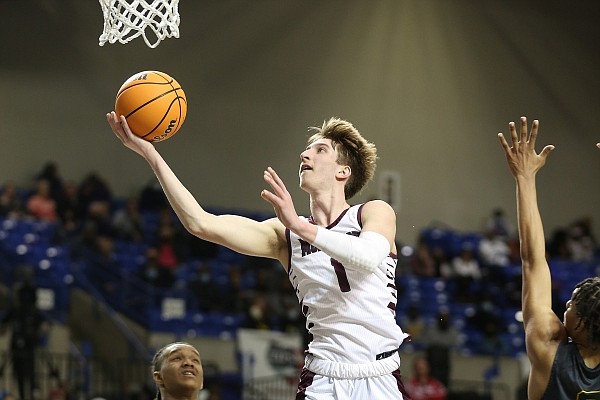 Morrilton's Joseph Pinion (1) lays in a shot over Mills' Jakari Livingston (5) during the fourth quarter of Mills' 49-46 win in the Class 4A boys state championship game on Saturday, March 10, 2021, at Bank OZK Arena in Hot Springs. More photos at www.arkansasonline.com/321boys4a/. Morrilton's Joseph Pinion (1) lays in a shot over Mills' Jakari Livingston (5) during the fourth quarter of Mills' 49-46 win in the Class 4A boys state championship game on Saturday, March 10, 2021, at Bank OZK Arena in Hot Springs. More photos at www.arkansasonline.com/321boys4a/.