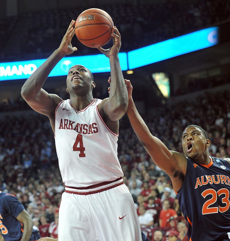 Arkansas Democrat-Gazette/MICHAEL WOODS --01/25/2012-- University of Arkansas forward Devonta Abron is fouled by Auburn defender Frankie Sullivan as he tries to drive to the hoop in the first half of Wednesday evenings game at Bud Walton Arena in Fayetteville.
