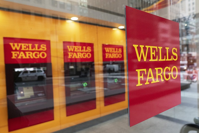 ATMs line the lobby of a Wells Fargo office in New York. Wells Fargo & Co. said Wednesday that its first-quarter net profit jumped to $4.74 billion from a year earlier.
(AP)