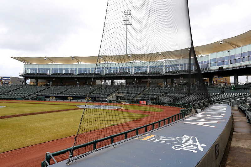A section of netting is visible Wednesday, February 26, 2020, over the visitors dugout at Arvest Ballpark in Springdale. (NWA Democrat-Gazette/David Gottschalk)