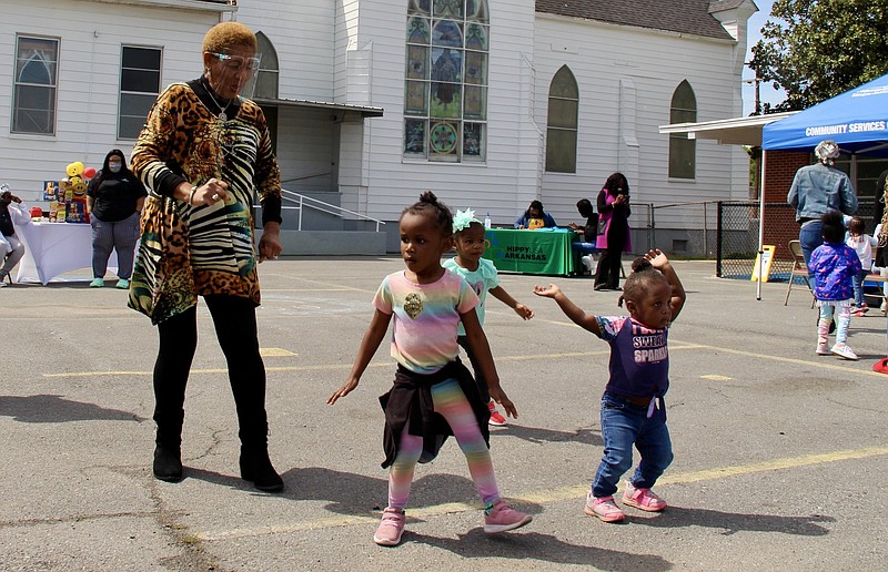 Mayor Shirley Washington shows that she can bust a move Thursday with Head Start students during an Arkansas Children’s Week celebration. 
(Pine Bluff Commercial/Eplunus Colvin)