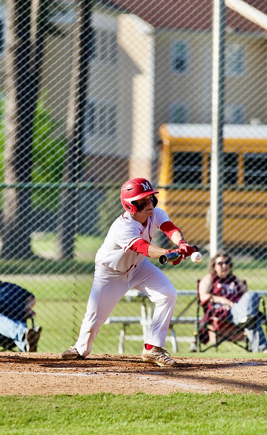 Magnolia’s Tanner Edwards puts down a bunt during action against Crossett on Tuesday. The Panthers will host Watson Chapel today and Monticello on Friday. (Photo by Bill Nielsen)