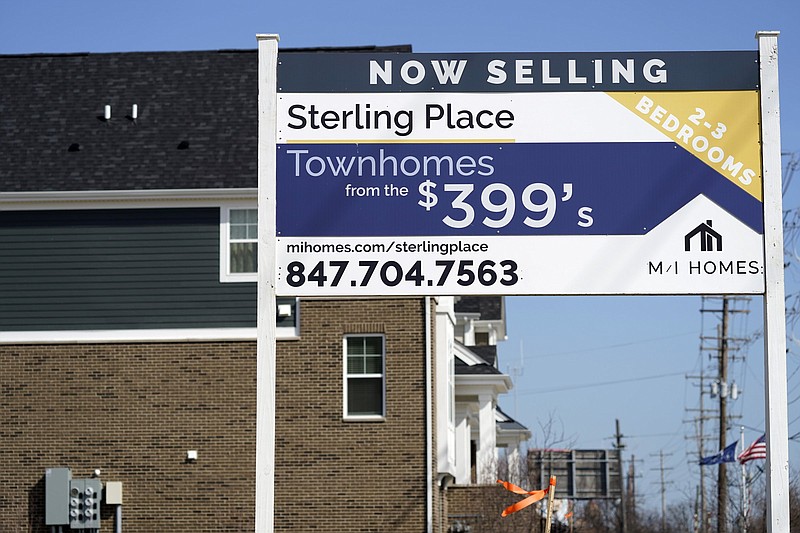 A sign advertising property stands near a construction site in March in Northbrook, Ill. Home construction rebounded in March after setbacks from winter storms in February.
(AP)