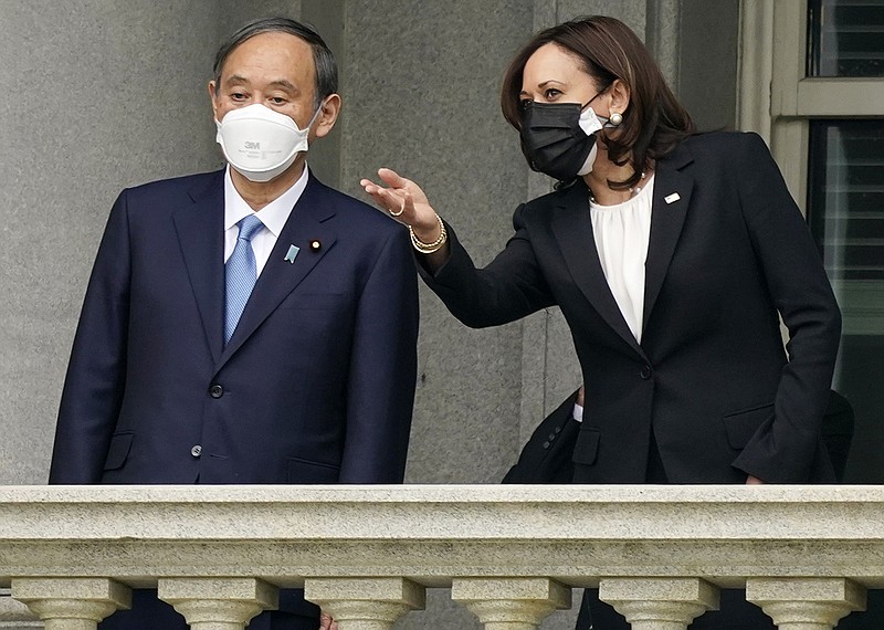 Japanese Prime Minister Yoshihide Suga visits Friday with Vice President Kamala Harris on the balcony of the Eisenhower Executive Office Building in Washington. Suga later met with President Joe Biden as the leaders stressed their alliance against China’s growing threat. More photos at arkansasonline.com/417usjapan/.
(AP/Andrew Harnik)