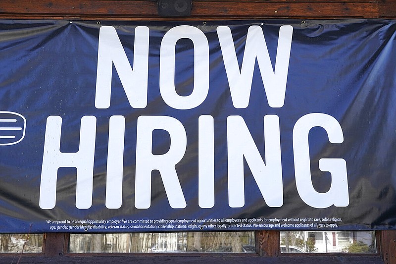 A restaurant displays a "Now Hiring" sign in this March 4, 2021, file photo. (AP/Elise Amendola)
