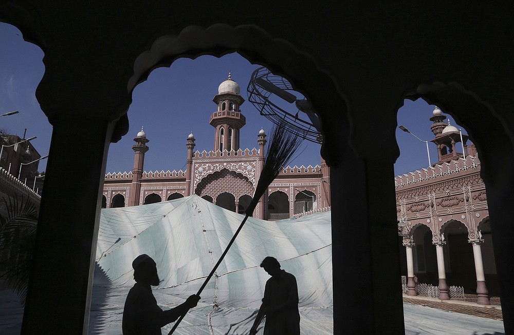 Volunteers clean the outer areas of the historic Mohabat Khan Mosque ahead of the Muslim fasting month of Ramadan, in Peshawar, Pakistan. Muslims are in the midst of their second Ramadan, which began Monday in the midst of the covid-19 pandemic.
(AP/Muhammad Sajjad)
